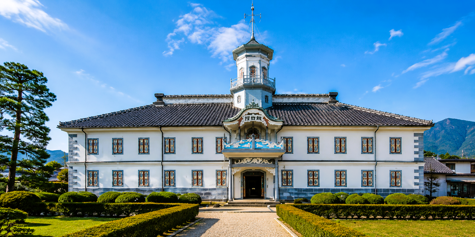 The octagonal-tower entrance facade of Former Kaichi School with its dragon and angel carvings